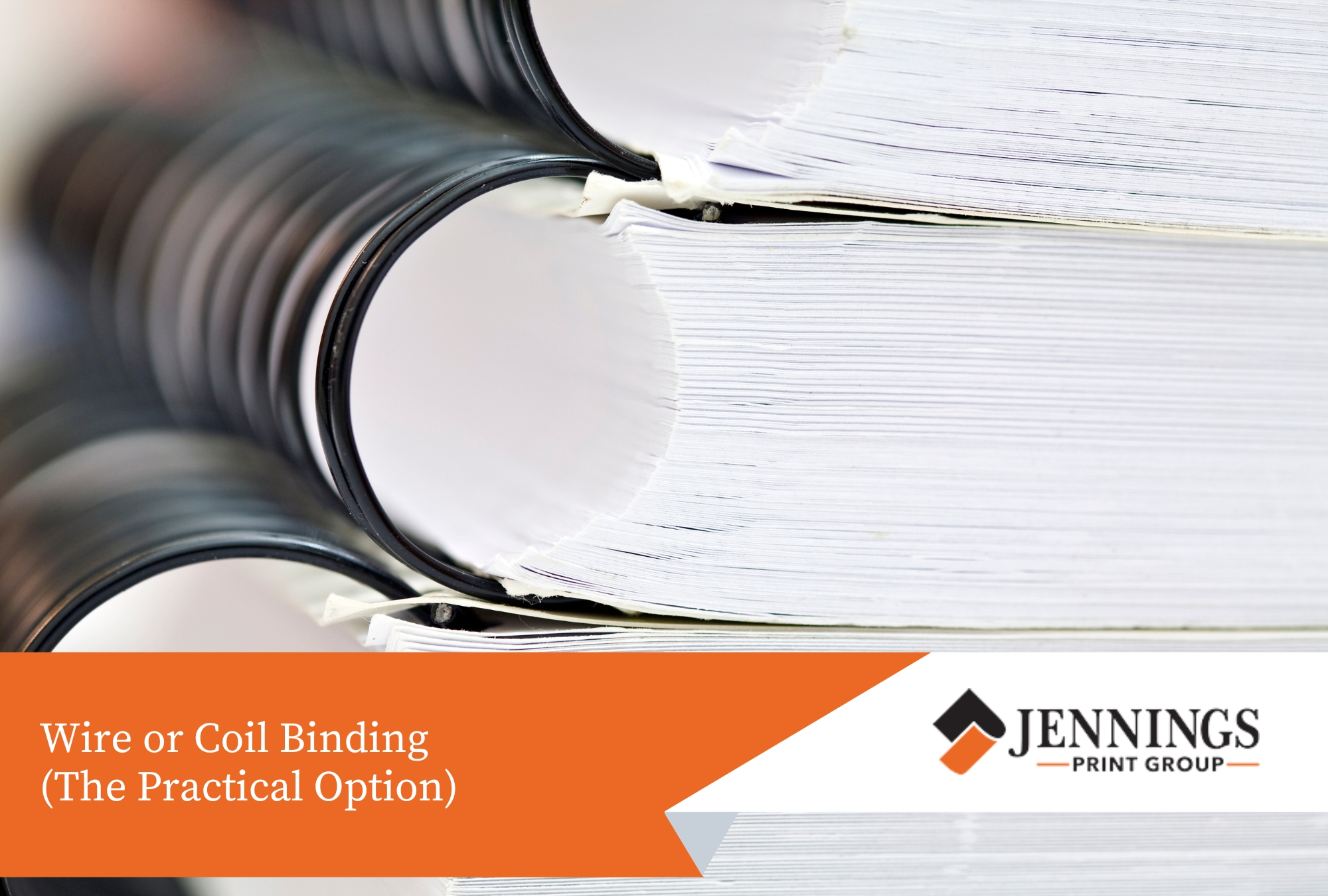 Training manual with black wire binding laying flat on a table